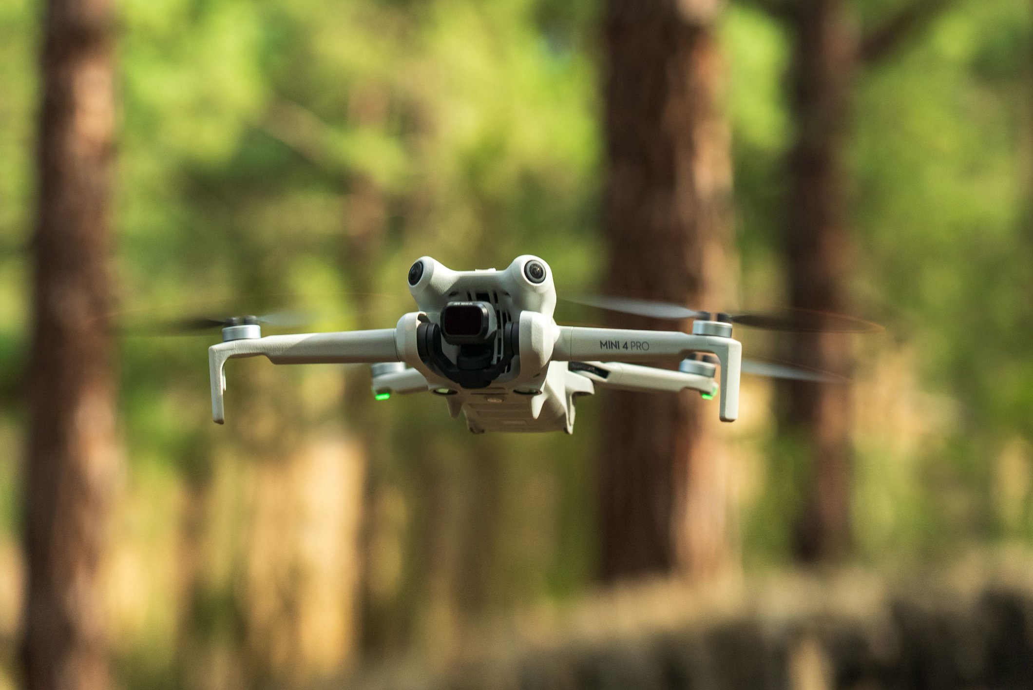A drone in flight over forest