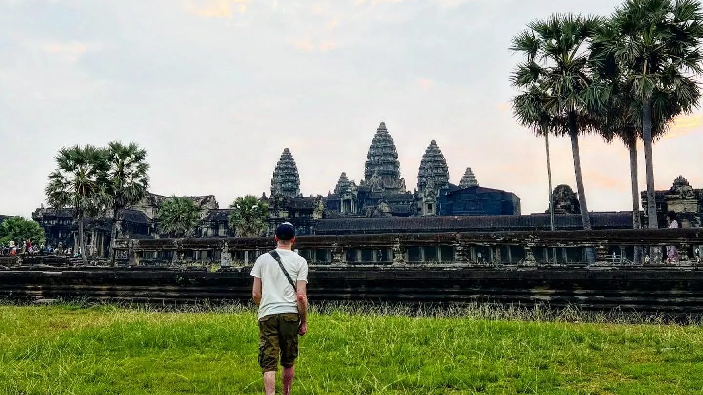 A traveller walking alone towards Angkor Wat, Cambodia