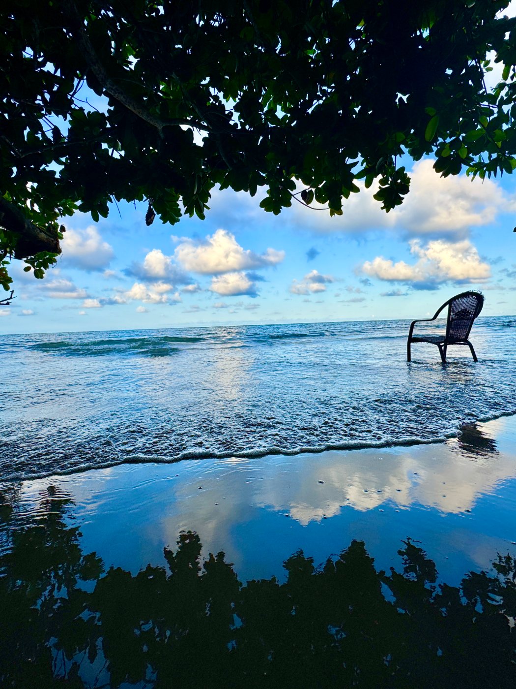A chair left in the shallows