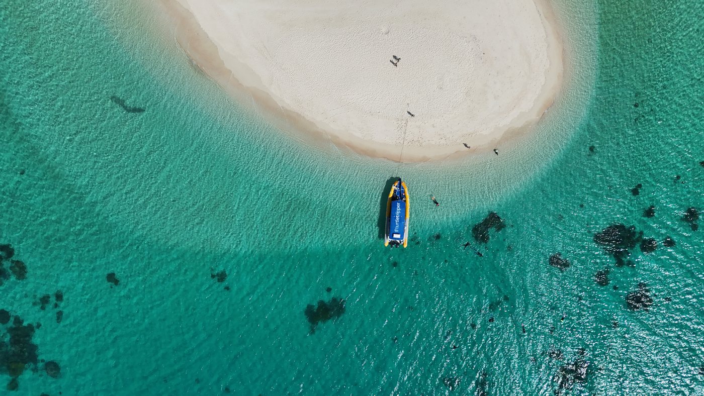 Boat moored at a reef sand cay