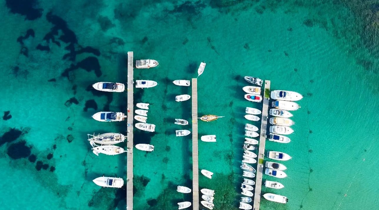 Boats moored in turquoise water