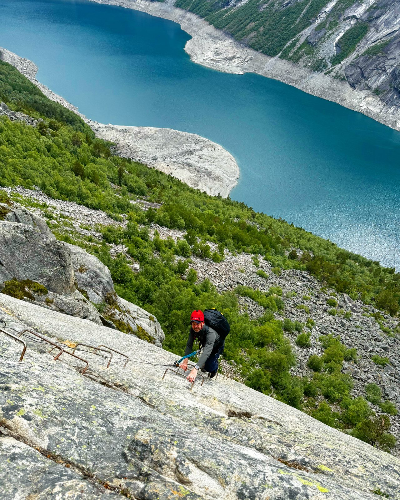 Standing on the Trolltunga rock formation